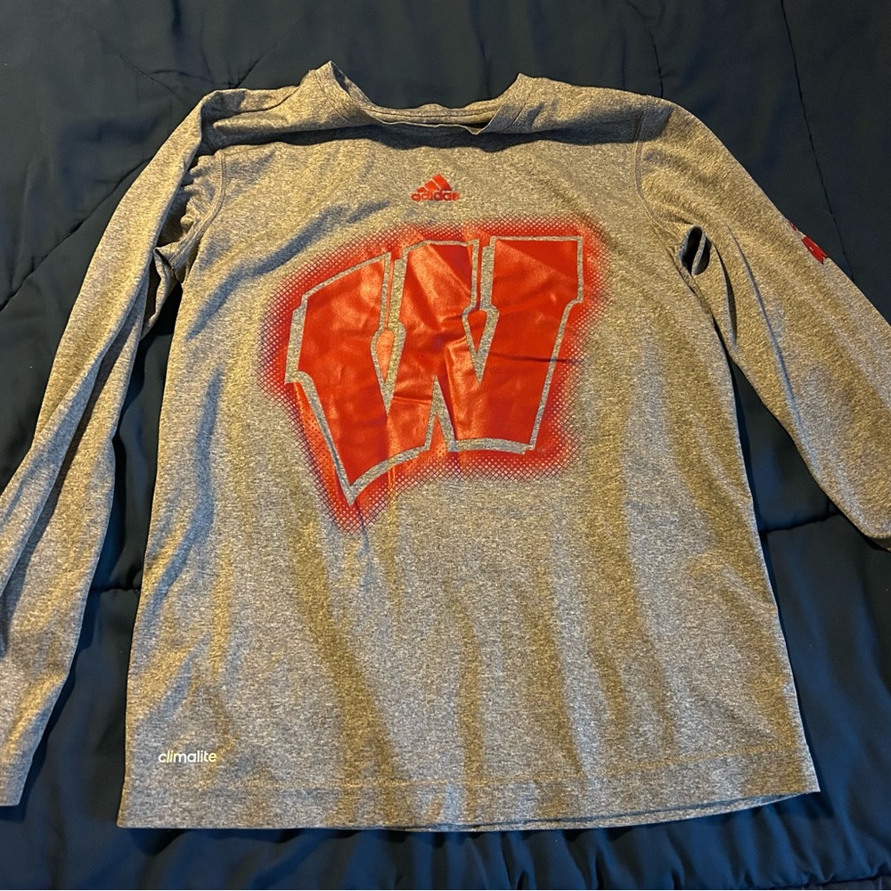 Adidas Climalite shirt features the University of Wisconsin Badgers.